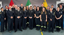 21 Paramedics stand together in uniform